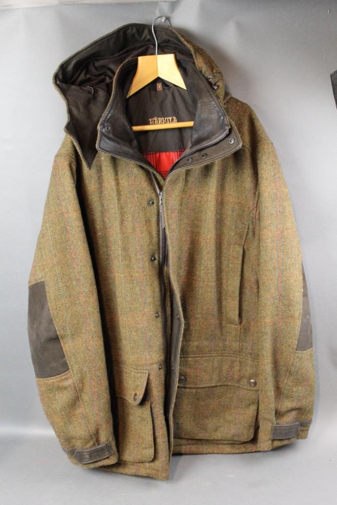 A Harkila tweed jacket Size 54 with hood.