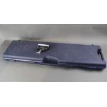 A Beretta hard plastic gun case, fitted for a semi automatic shotgun with 35" barrel,