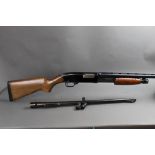 A Winchester Model 120 12 bore pump action shotgun, with two barrels,