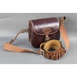 E Jeffreys a leather and leatherette cartridge bag, together with a leather cartridge belt.