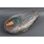 A carved wooden Magnum duck decoy, with marble glass eyes, mid 20th century, length 47 cm.