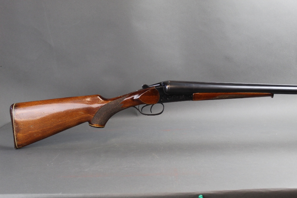 A Baikal 12 bore side by side shotgun, with 28 1/2" barrels, 1/4 and 3/4 chokes, 2 3/4" chambers,