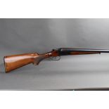 A Baikal 12 bore side by side shotgun, with 28 1/2" barrels, 1/4 and 3/4 chokes, 2 3/4" chambers,