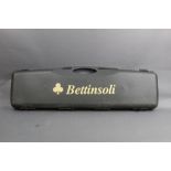 Bettinsoli a hard plastic shotgun case with space for 36" over/under barrels.