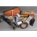 Box lot containing Webley Tempest leather holster, various shotgun and rifle cleaning kits,