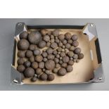 A Quantity of cannon and musket balls, ranging in diameter from +/- 2 3/4" - 1/4".
