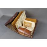 Two cast wallets, the first marked JH Watson, 44 High Street, Cleator Moor, width 27 cm,