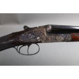 A Gold Sable 20 bore side by side shotgun, with 26 3/4" barrels, 1/4 and 1/2 chokes, 70 mm chambers,