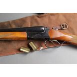 A Baikal 12 bore side by side shotgun, with 28 1/2" barrels, 1/2 and 3/4 chokes, 70 mm chambers,