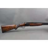 A Browning S2 over/under shotgun with 26" barrels, 1/4 and cylinder choke, 2 3/4" chambers, ejector,