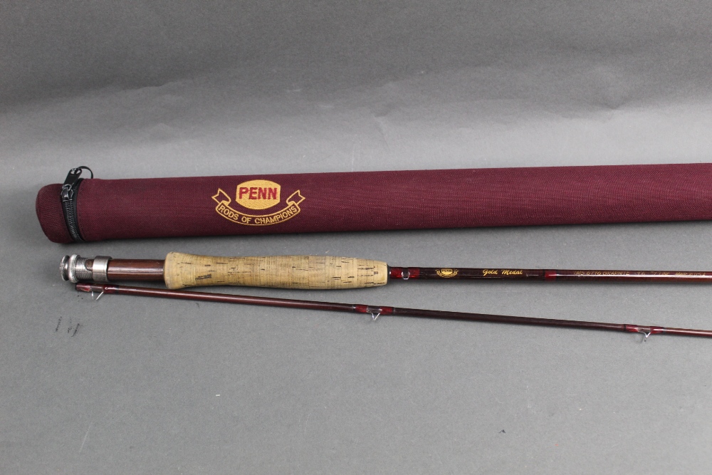 A Penn Gold Medal trout fly rod Model IMS 6796 in two sections, 9' 6" line 7.