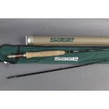 Sage XP 690 Graphite 3E trout fly rod, in two sections 9' line 6, with hard rod tube.