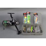 An Abu Garcia tackle box containing Rapalas, various spoons etc and a Spitfire fixed spool reel.
