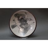A Studio Pottery bowl, decorated to the centre with a Jay in flight. Bowl diameter 21.