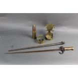 A cruciform bayonet, together with three pieces of trench art,