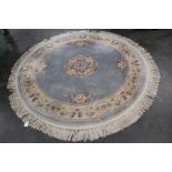 Circular tasselled Chinese rug,