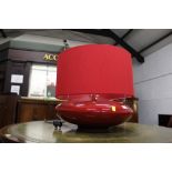 Large red squat based lamp with matching shade,