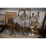 Two brass table lamps with white glass shades,