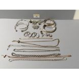 Bag of silver costume jewellery, bracelets, brooches, chains etc,