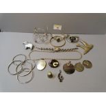 Bag of white metal costume jewellery, bangles,