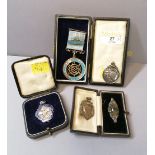 Collection of silver and enamelled fobs,