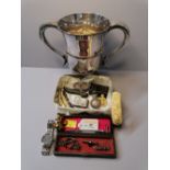 Silver plated trophy, box of miniature penknives, wristwatch, silver Vesta case,