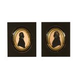 A pair of 18th century oval silhouettes, gentlemen in glazed and gilt frames.