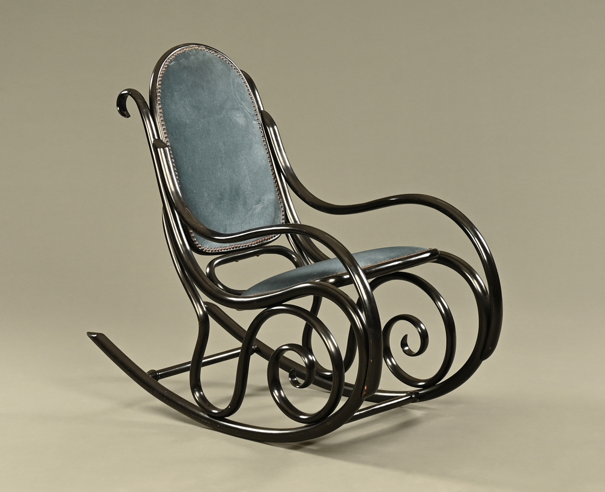 A Thonet style bentwood rocking chair, with ebonised finish,