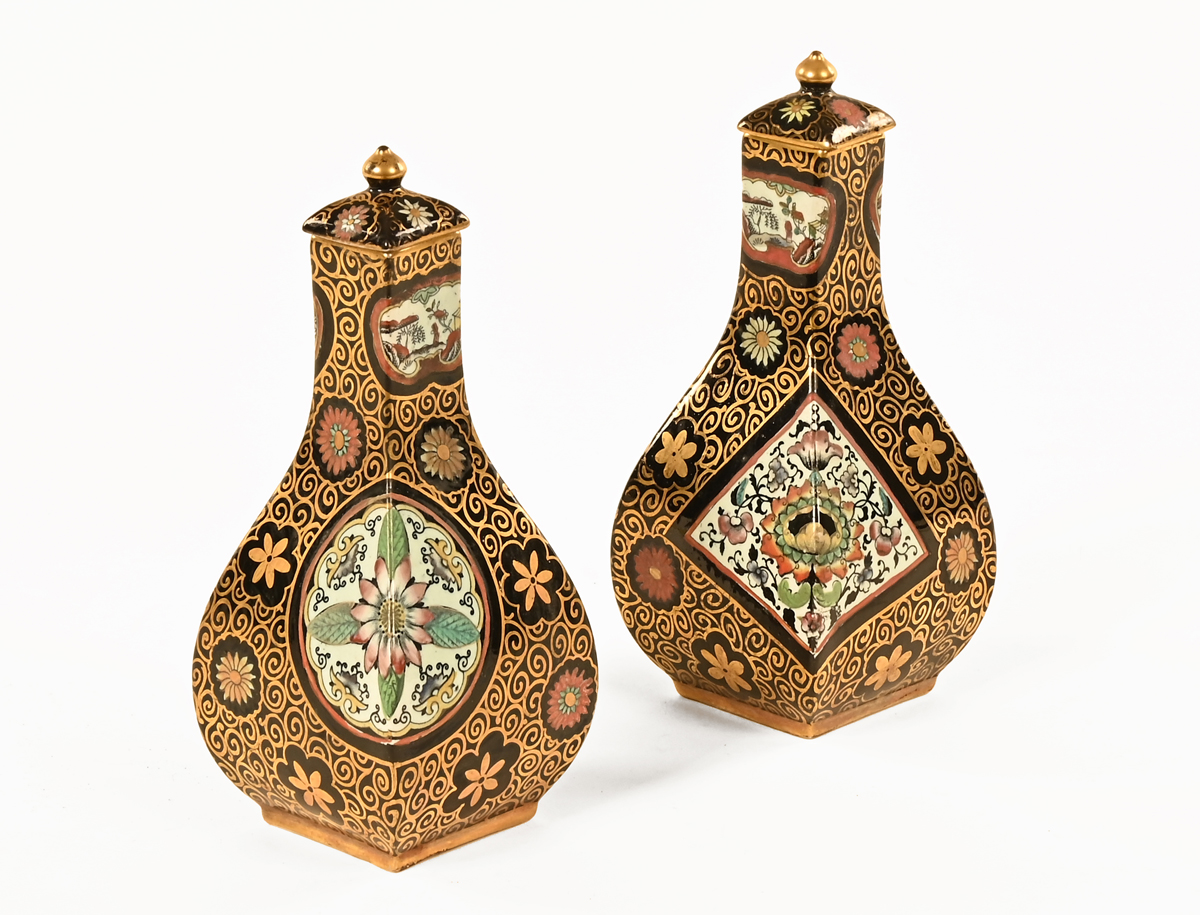 A pair of 19th century pottery lidded vases, Staffordshire,