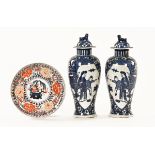 A pair of Chinese blue and white lidded vases, together with an Imari plate. Vase height 27.5 cm.