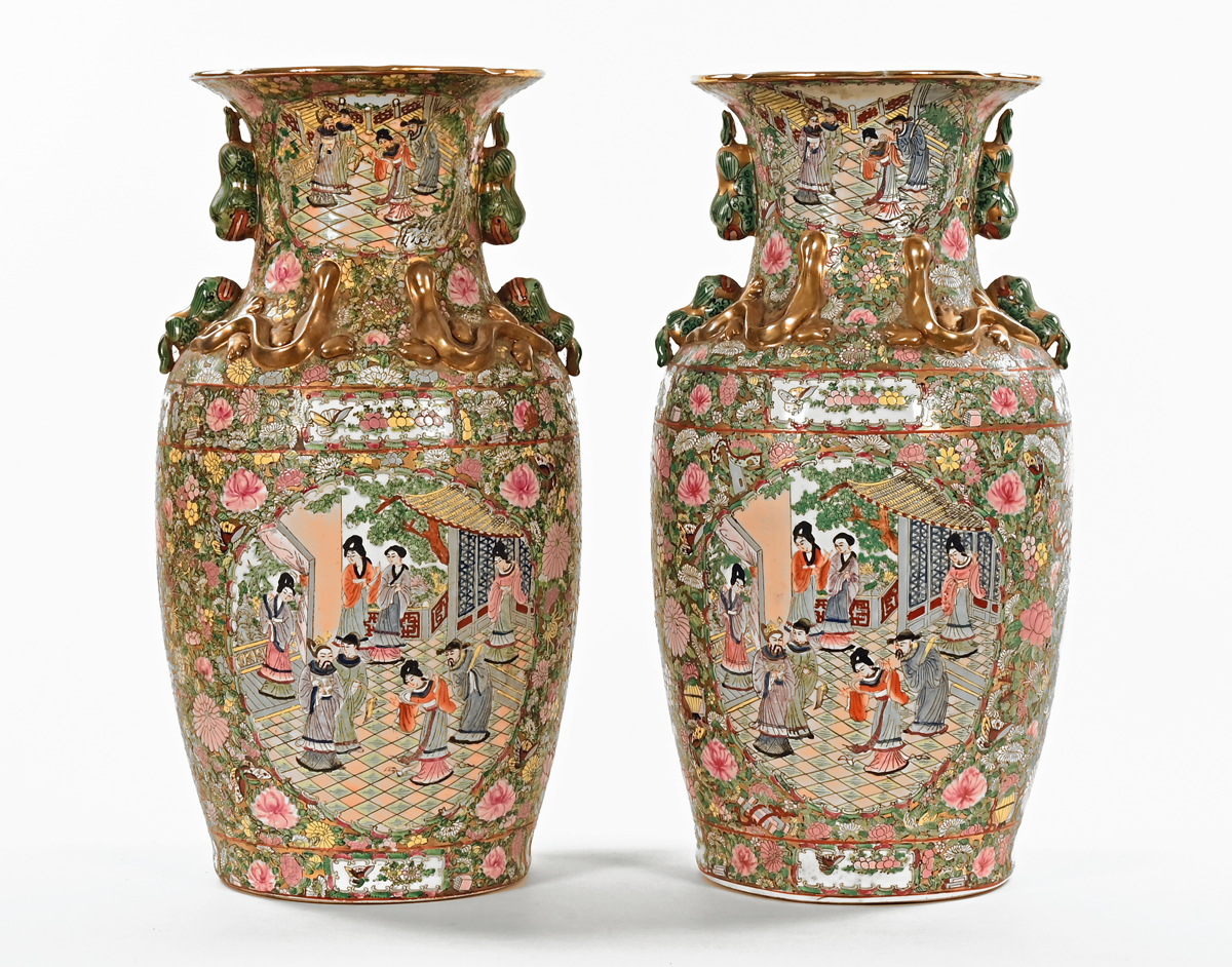 A pair of 19th century style Cantonese vases, decorated in typical Canton colours,