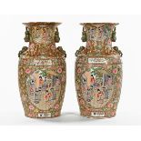 A pair of 19th century style Cantonese vases, decorated in typical Canton colours,