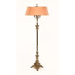A silver plated lamp standard, four branch with knopped stem, triform base and paw feet.