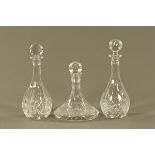 A ships type decanter, and two other club shaped decanters.