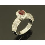 An 18 ct white gold Burmese ruby and diamond ring, ruby +/- 1 carat, size P.