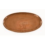 An Arts & Crafts planished copper oval tray by Hugh Wallis,