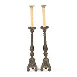 A large pair of pewter candlesticks, with light fittings, both indistinctly stamped B????. Mott.