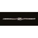 An 18 ct white gold diamond and sapphire bracelet, stamped 750. Weight 25 grams.