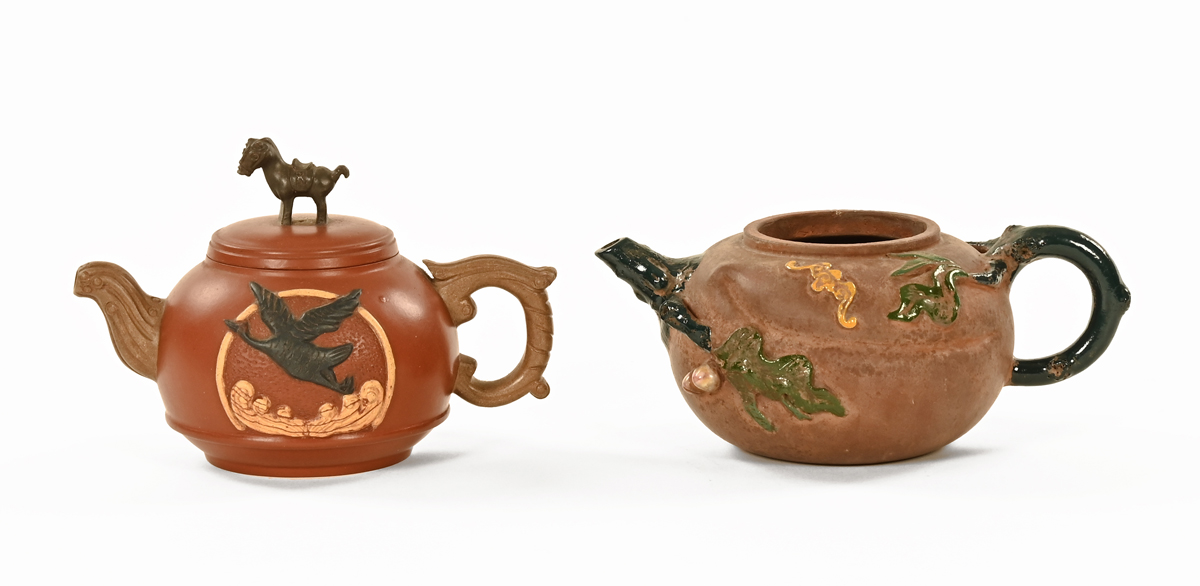 Two Chinese Yixing teapots. Largest length 17 cm.