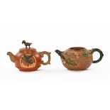 Two Chinese Yixing teapots. Largest length 17 cm.