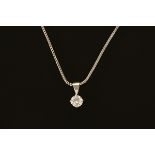 An 18 ct white gold pendant on chain, set with a diamond weighing +/- .57 carats.
