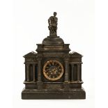 A large black slate late Victorian mantle clock with bronze figural mounts.