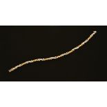 An 18 ct two tone gold bracelet, set with diamonds weighing +/- .36 carats.