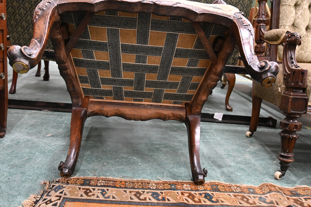 An 18th century armchair, with upholstered back and seat and with foliate carved outswept arms, - Image 8 of 9