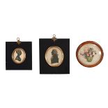 Two oval 19th century silhouette portrait miniatures, and a dried flower picture.