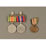 A Second World War duo of medals, uninscribed and and Italian Africa Corps medal.