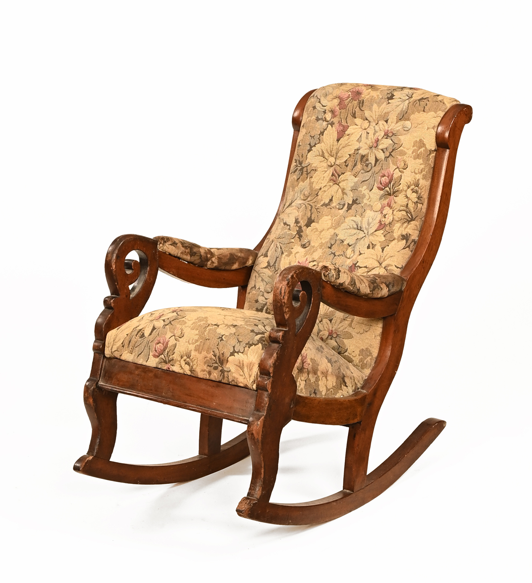 A Victorian child's rocking chair, with deep buttoned back and stuffover seat.