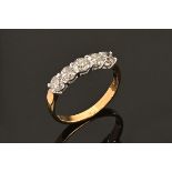 An 18 ct two tone gold five stone half eternity ring, set with diamonds weighing +/- 1.11 carats.