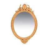 A late 19th/early 20th century giltwood and gesso oval framed wall mirror.