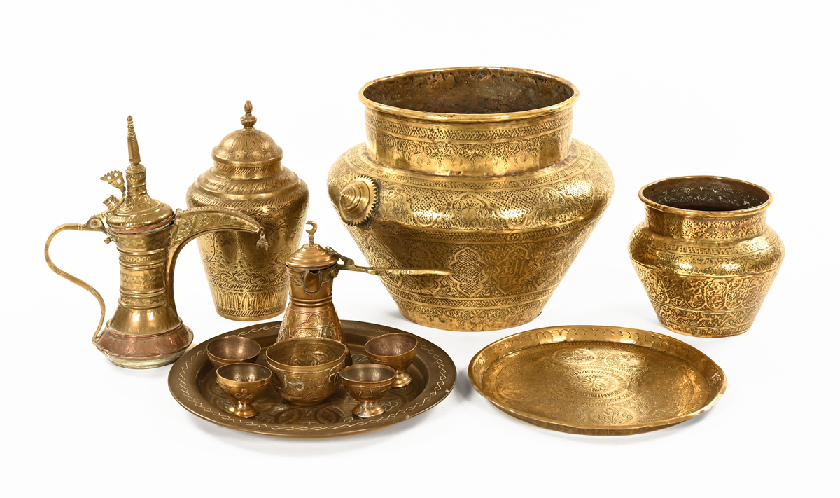 A quantity of antique Islamic copper items.